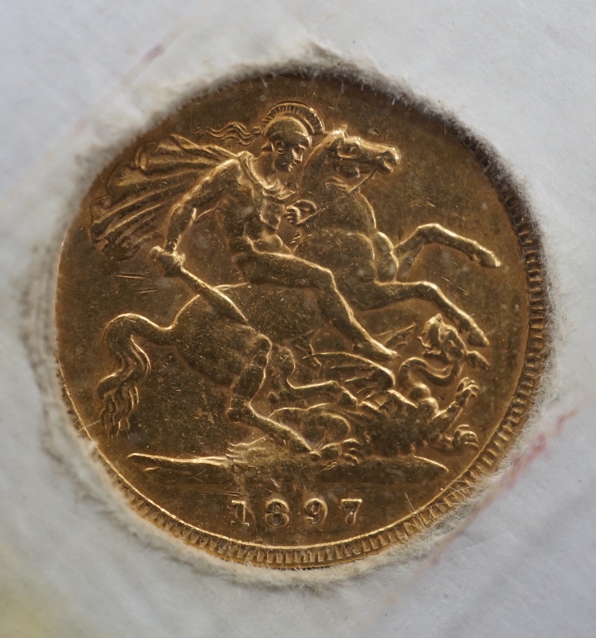 A Victorian 1897 gold half sovereign.